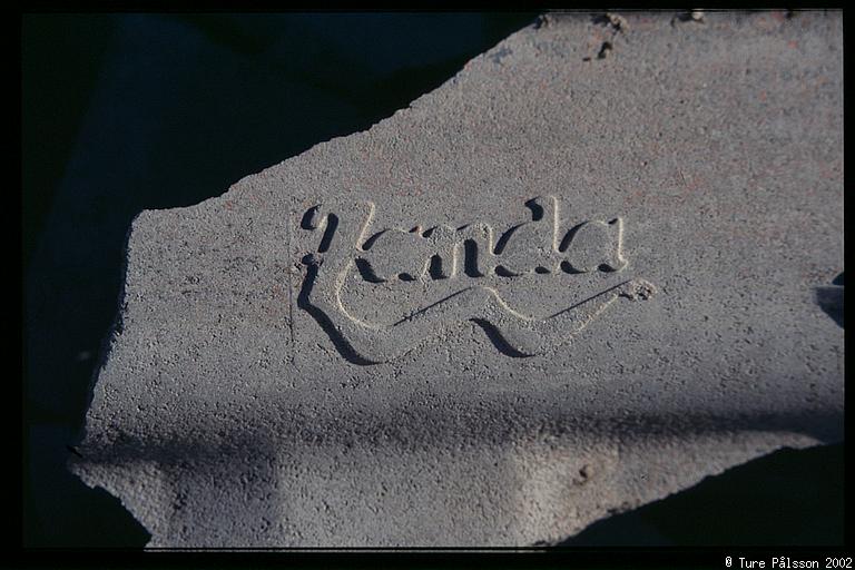 Concrete tile with logotype