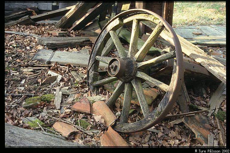 Old wheel in ruin